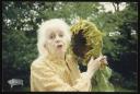 Unknown Photographer, ‘Photograph of Marie-Louise von Motesiczky standing in a garden holding a sunflower ’ [c.1990s]