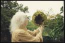 Unknown Photographer, ‘Photograph of Marie-Louise von Motesiczky standing in a garden with a sunflower’ [c.1990s]