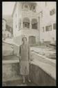 Walter Kielinger, ‘Photograph of Marie-Louise von Motesiczky standing, holding a cigarette in the courtyard against the backdrop of a Mediterranean villa’ [c.1920s–1930s]