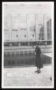 Unknown Photographer, ‘Photograph of Marie-Louise von Motesiczky standing in front of a pool beyond a modernist building of glass and brick’ [c.1930s–1940s]