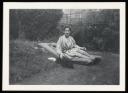 Unknown Photographer, ‘Photograph of Marie-Louise von Motesiczky seated on an airbed in a garden with a dog ’ [c.1940s]