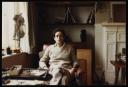 Marie-Louise Von Motesiczky, ‘Colour photograph of Jeremy Adler posing in Marie-Louise’s studio with a sketch of an old woman on the mantelpiece’ [1990–4]