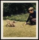 Unknown Photographer, ‘Photograph of Charlotte Bondy playing with a dog ’ [c.1960]