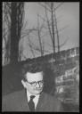 Unknown Photographer, ‘Photograph of Elias Canetti standing beside a brick wall with bare tree branches in the background’ 1963 
