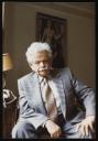 Marie-Louise Von Motesiczky, ‘Photograph of Elias Canetti sitting in front of Marie-Louise von Motesiczky’s painting ‘At the Dressmaker’ ’ July 1983 