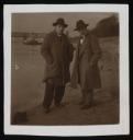 Unknown Photographer, ‘Photograph of Theo Garve and Karl Tratt standing together in front of a harbour ’ [1927–8]  