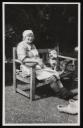 Unknown Photographer, ‘Photograph of Marie Hauptmann seated on a garden bench with a dog ’ [c.1940s–1954] 