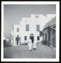 Marie-Louise Von Motesiczky, ‘Photograph of a building and two unidentified people in Tunisia’ [1964]
