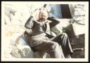 Marie-Louise Von Motesiczky, ‘Photograph of Godfrey Samuel sitting on rocks, laughing, in Morocco or Tunisia’ April 1973