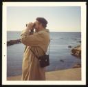 Marie-Louise Von Motesiczky, ‘Photograph of Godfrey Samuel looking at the sea through a pair of binoculars in Scotland’ October 1974  