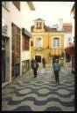 Marie-Louise Von Motesiczky, ‘Photograph of two unidentified people walking down a street in Cascais, Portugal’ [1994]  