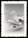 Unknown Photographer, ‘Photograph of a young woman leaning on a balcony, over-looking snow covered mountains in Switzerland’ [1920s–1930s]