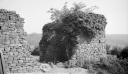 Paul Nash, ‘Black and white negative, a stone wall, overgrown structure, Forest of Dean’ 1938