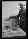 Julius Bissier, ‘Photograph of Ben Nicholson standing next to table with glasses on it’ 1959