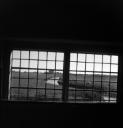 John Piper, ‘Photograph of the view through a window possibly at St Thomas A. Becket’s Church in Fairfield, Kent’ [c.1930s–1980s]