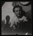 Eileen Agar, ‘Photograph of Joseph Bard sitting in the garden partially nude’ [1930s]