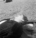 Eileen Agar, ‘Photograph of Simone Dear lying on a pebble beach’ [1939]