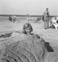 Eileen Agar, ‘Photograph of a girl buried in the sand at the beach’ [1938]