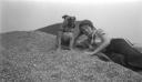 Joseph Bard, ‘Photograph of Eileen Agar lying on a pebble beach at West Bay with her dog, Dandy’ 1934