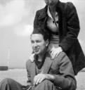 Eileen Agar, ‘Photograph of David Dear sitting with his wife, Simone Dear standing over him’ [1939]