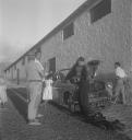 Eileen Agar, ‘Photograph of men fixing a car on a village street in Puerto de la Cruz, Tenerife’ 1952–6
