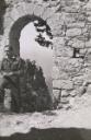 Unknown artist, ‘Photograph of Robert Medley in uniform, walking through a stone arch in an unidentified location [Egypt?] while serving in the Second World War’ [1940–4]