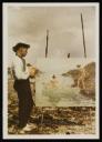 Anonymous, ‘Colour glass transparency photograph of Henry Scott Tuke on the beach painting ‘The Embarcation’ 1914’ [c.1911–14]
