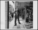 Nigel Henderson, ‘Photograph of Nigel Henderson reflected in shop front mirror’ [c.1950]
