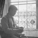 Nigel Henderson, ‘Photograph of Eduardo Paolozzi working at a window with balsa wood’ June 1951