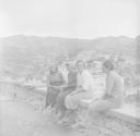 Nigel Henderson, ‘Photograph showing four unidentified women sitting on a wall’ [c.1951–2]