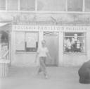 Nigel Henderson, ‘Photograph of the front of butcher shop from outside’ [c.1951–2]