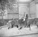 Nigel Henderson, ‘Photograph of an unidentified man surrounded by cats’ [c.1951–2]