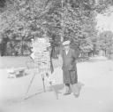 Nigel Henderson, ‘Photograph of a street vendor selling postcards’ [c.1951–2]