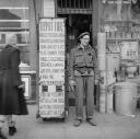Nigel Henderson, ‘Photograph of an unidentified man standing outside a shop’ [1949–54]