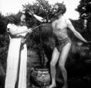 Eileen Agar, ‘Black and white glass lantern slide of Mary Oliver spraying Joseph Barda with a hose’ [c.1930]