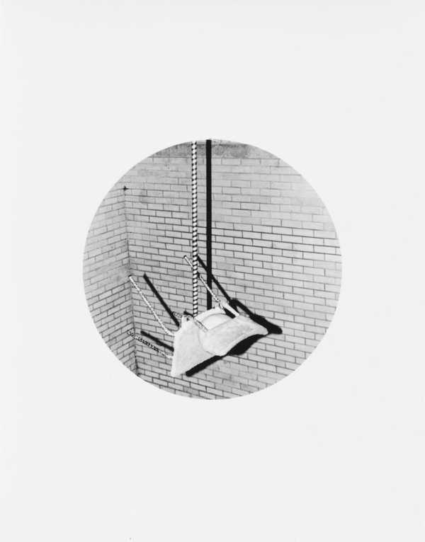 Untitled (Chair balancing on stick)