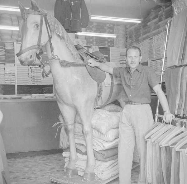  Photograph Of The Interior Of A Clothes Shop With Unidentified Man