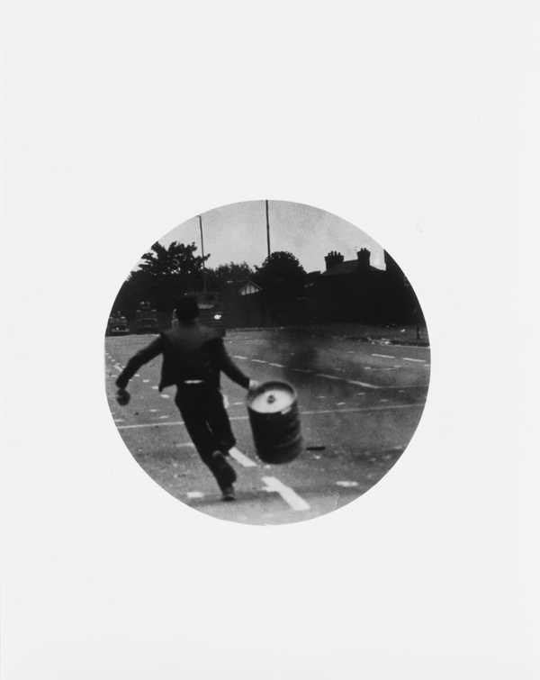 Untitled (Boy running with barrel)