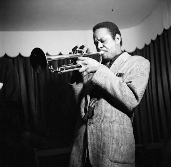 Photograph of a musician performing on trumpet, possibly Dizzy Reece ...