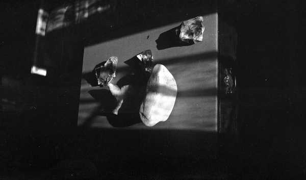 Black and white negative, still life, flints and shadows on a table ...