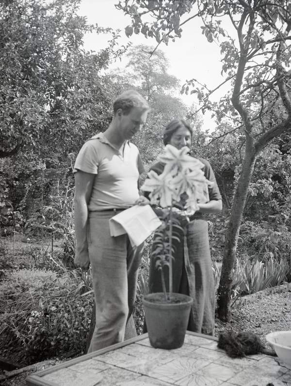 Black and white negative of Julian Bell and Tony Pirie standing behind ...