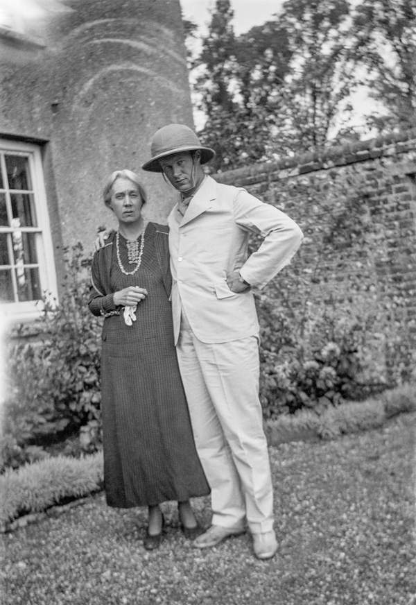 Black and white negative of Vanessa and Julian Bell standing and