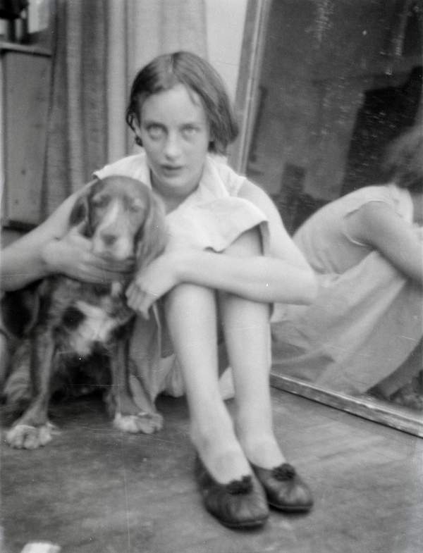 Black and white negative of Angelica Bell seated in front of a mirror ...