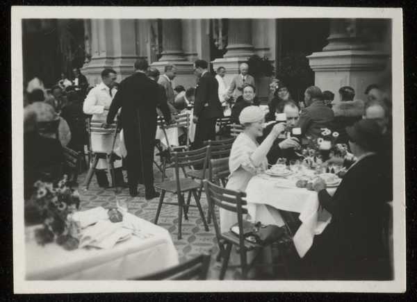 Photograph of several people sitting down at a wedding reception ...