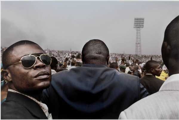 Jean-Pierre Bemba, presidential candidate, enters a stadium in central Kinshasa flanked by his bodyguards, July 2006