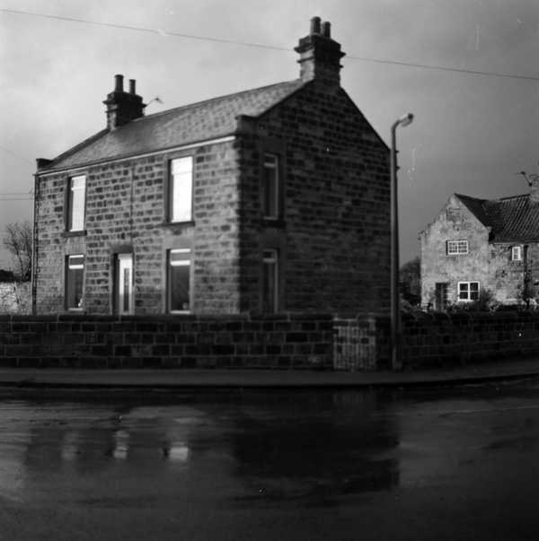 Photograph of a house at the junction of Brampton Road and Toad Lane in