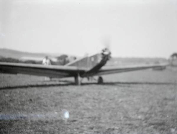 Black and white negative of the front of David Garnett’s aeroplane in a ...