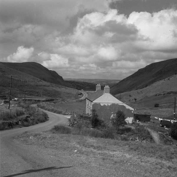 Photograph of a view down a country road in Cwm Berwyn, east of Tregaron, Cardiganshire, Wales