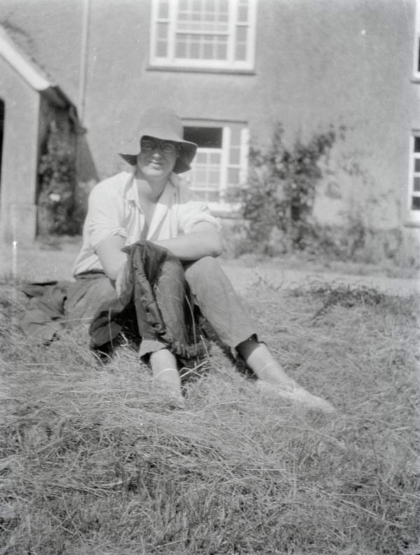 Black and white negative of Julian Bell wearing glasses and a hat ...