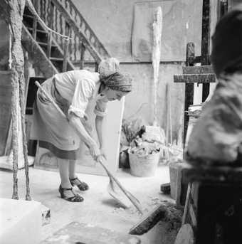 Annette cleaning the studio, ca. 1954